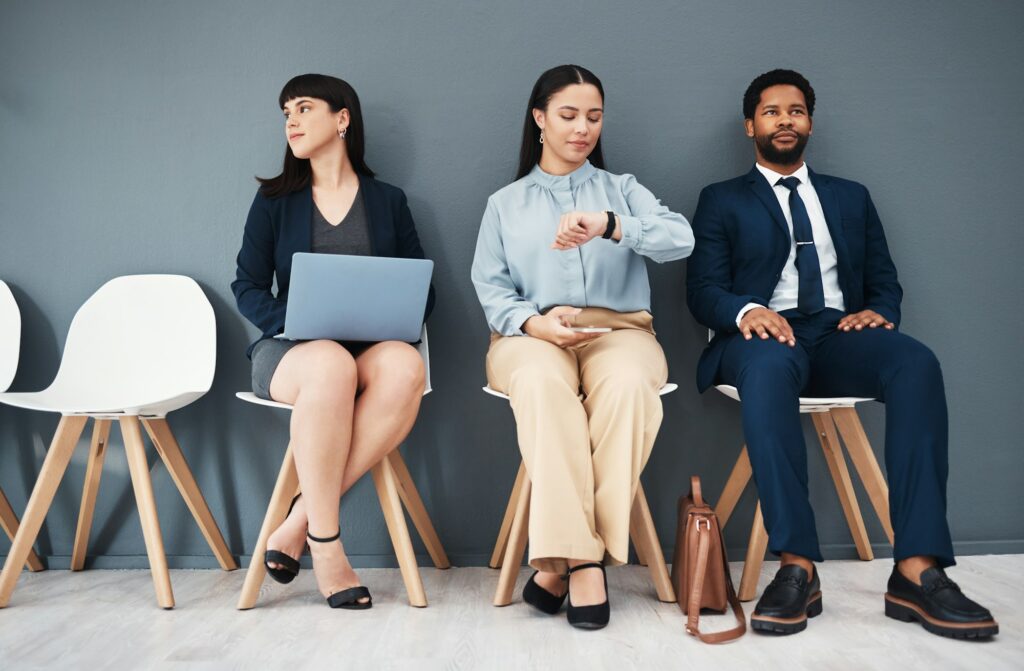 Recruitment, job interview and time with business people in waiting room for schedule, hr or consul